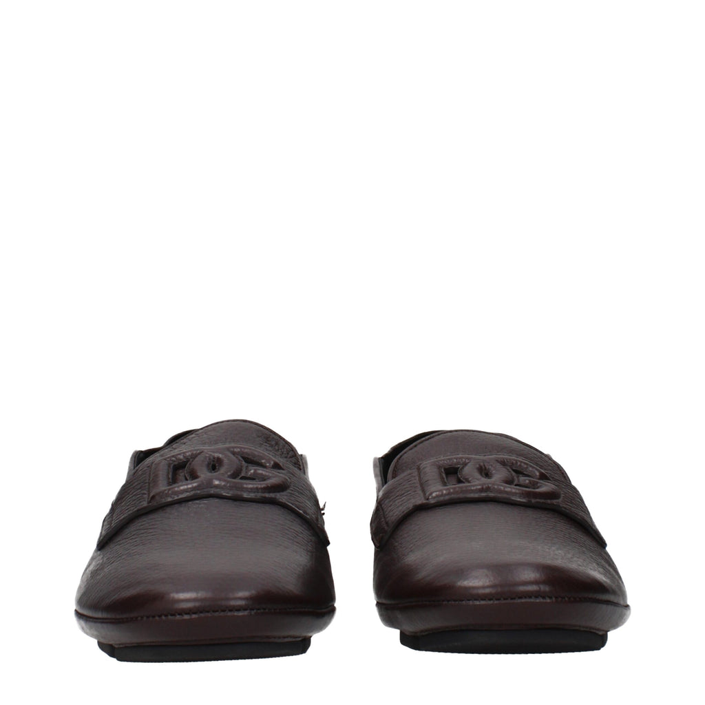 Dolce & Gabbana brown leather slip-on loafers with sleek design and classic stitching, perfect for stylish casual wear.