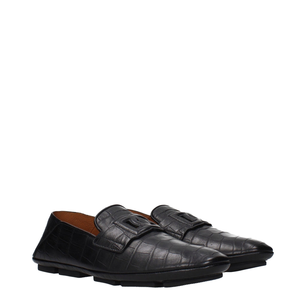 Dolce & Gabbana black leather slip-on loafers with sleek design and subtle stitching details.