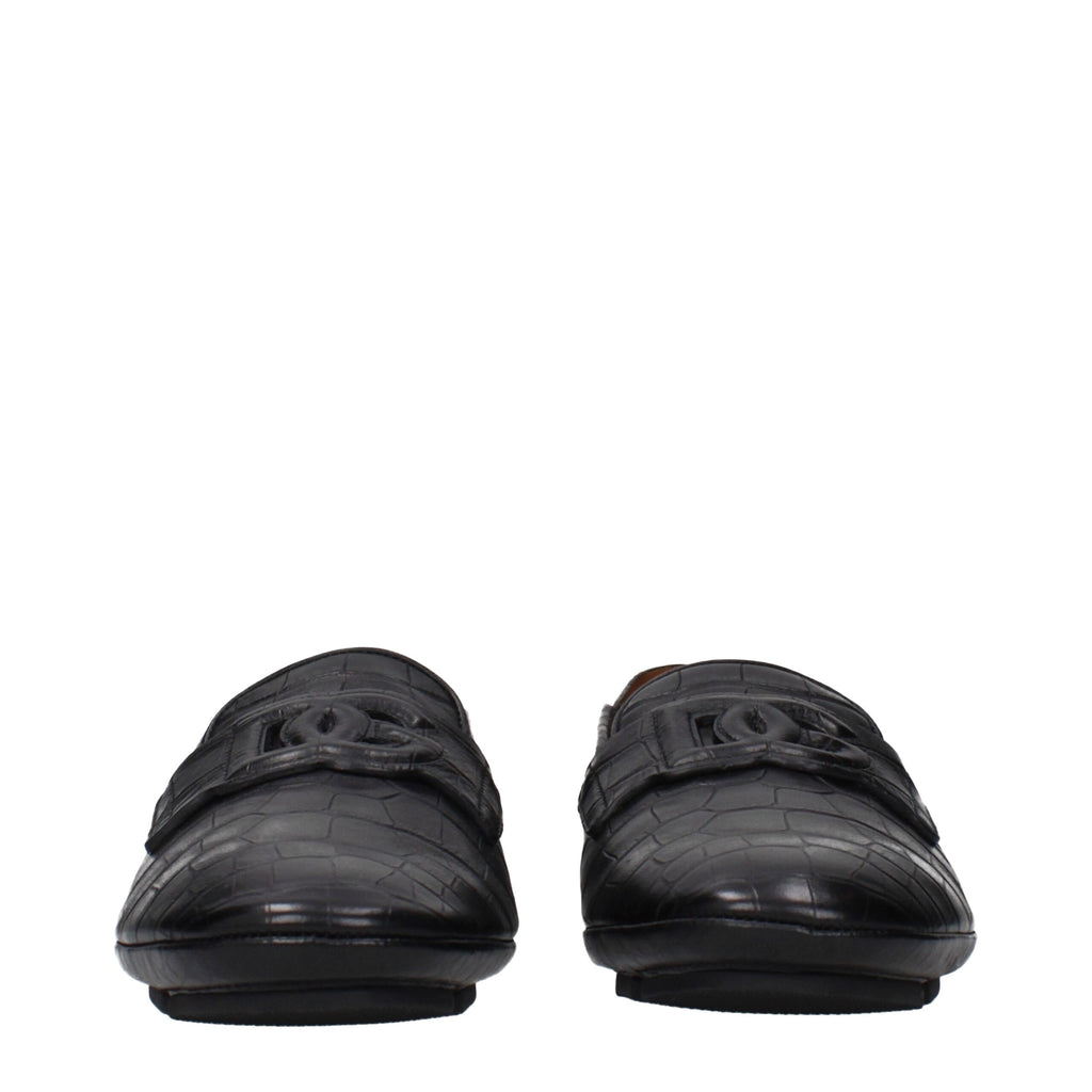Black leather Dolce & Gabbana slip-on loafers with sleek design and subtle stitching details.