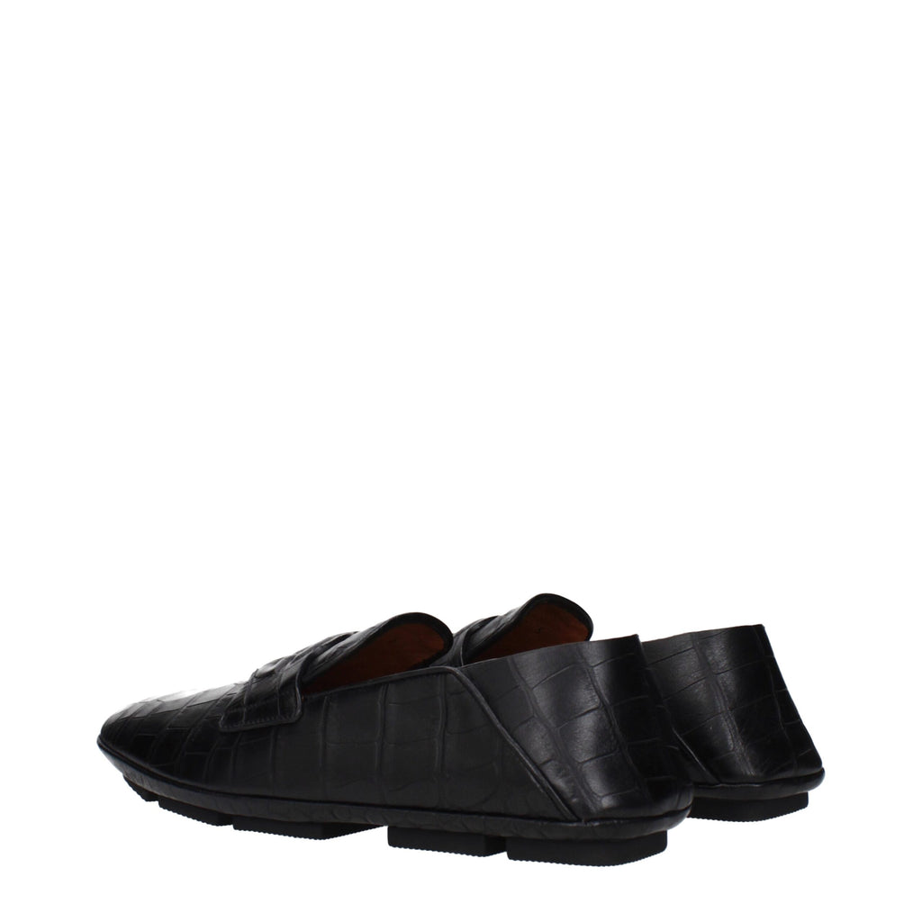 Black leather slip-on loafers by Dolce & Gabbana featuring sleek design and classic style.