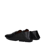 Black leather slip-on loafers by Dolce & Gabbana featuring sleek design and classic style.