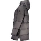 North Sails Nero polyester women's jacket shown on a model, featuring a sleek black design with a fitted style and functional details.