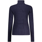 Norway 1963 blue viscose women's sweater showing a relaxed fit with long sleeves and a round neckline.
