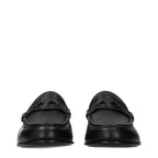 Valentino Garavani black leather slip-on loafers with sleek design and subtle stitching, perfect for stylish casual wear.