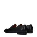 Valentino Garavani black leather slip-on loafers with sleek design and subtle stitching detail.