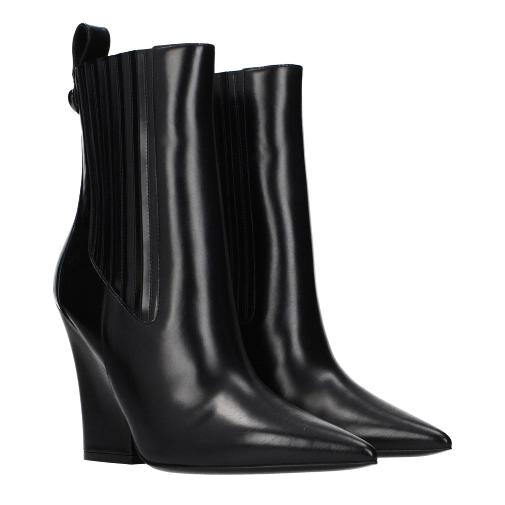 Black leather ankle boots by Valentino Garavani featuring sleek design and subtle heel detail.