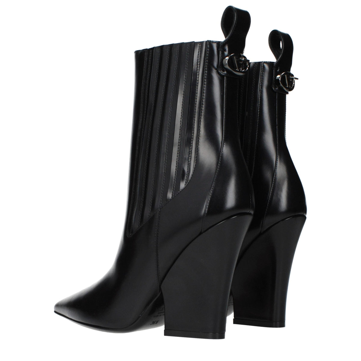 Black leather ankle boots by Valentino Garavani featuring sleek design and pointed toes.
