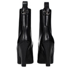 Valentino Garavani black leather ankle boots with sleek design and pointed toe, stylish footwear for women.