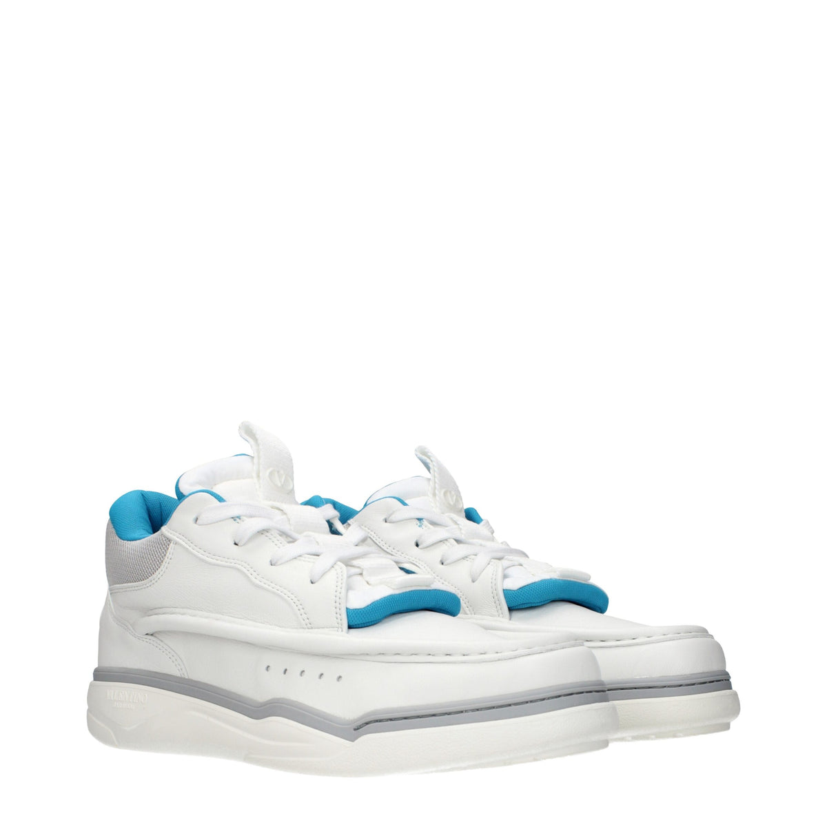 White leather Valentino Garavani low top sneakers with sleek design and subtle branding, perfect for casual and stylish wear.