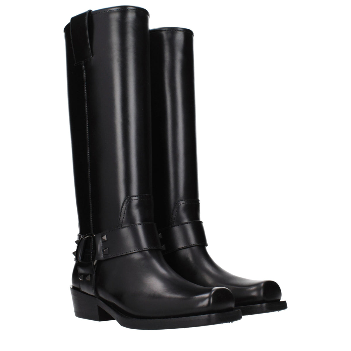 Black leather Valentino Garavani boots with sleek design and pointed toes, stylishly displayed on a neutral background.