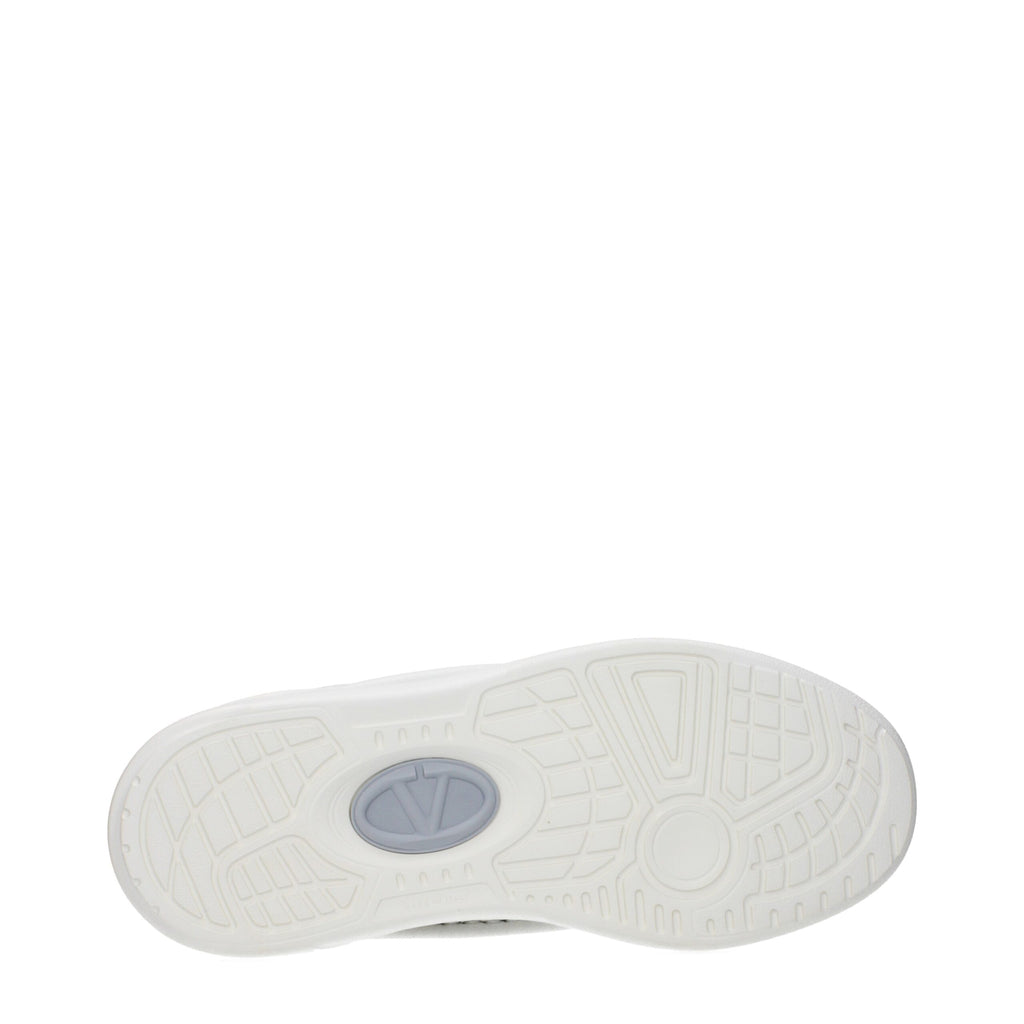 White leather Valentino Garavani low top sneakers with sleek design and subtle branding, featuring white laces and rubber soles.