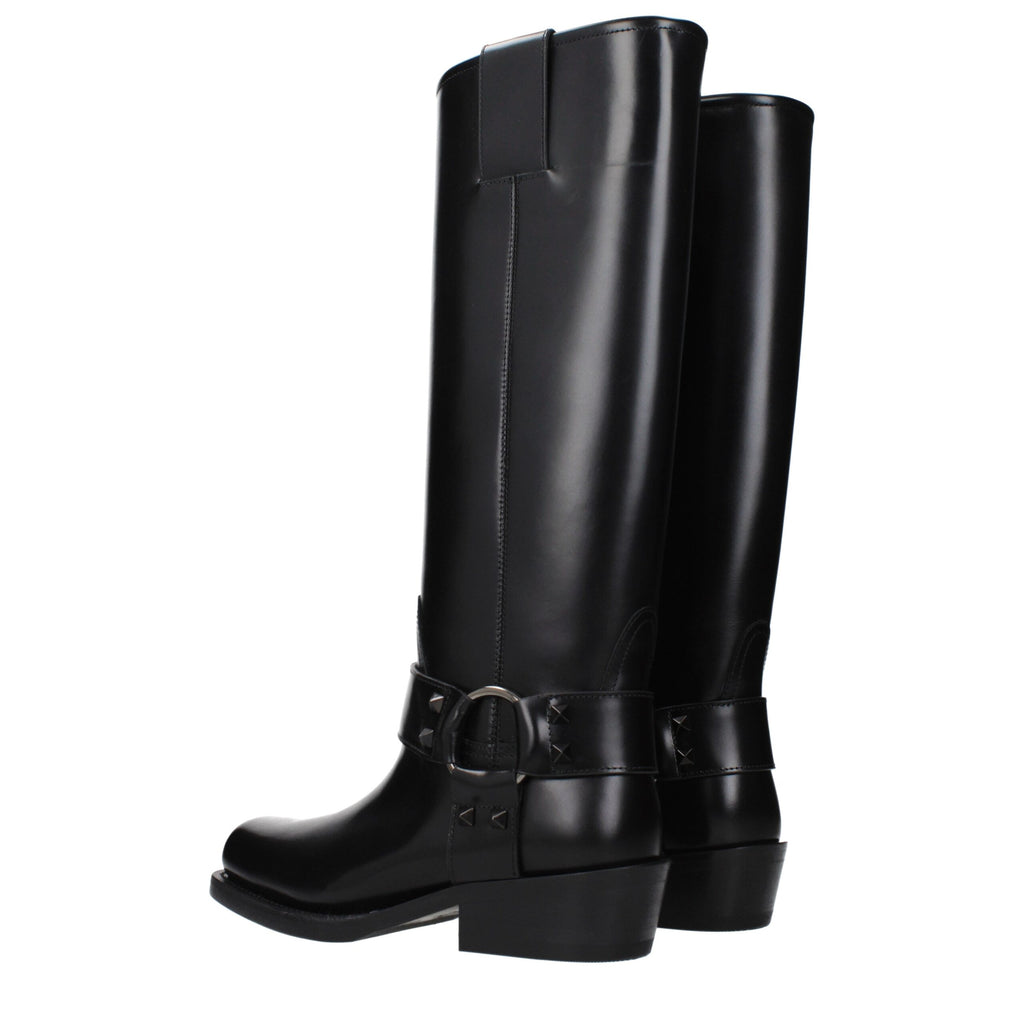 Black leather boots from Valentino Garavani with sleek design, pointed toe, and ankle-high style.