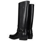 Black leather boots from Valentino Garavani with sleek design, pointed toe, and ankle-high style.