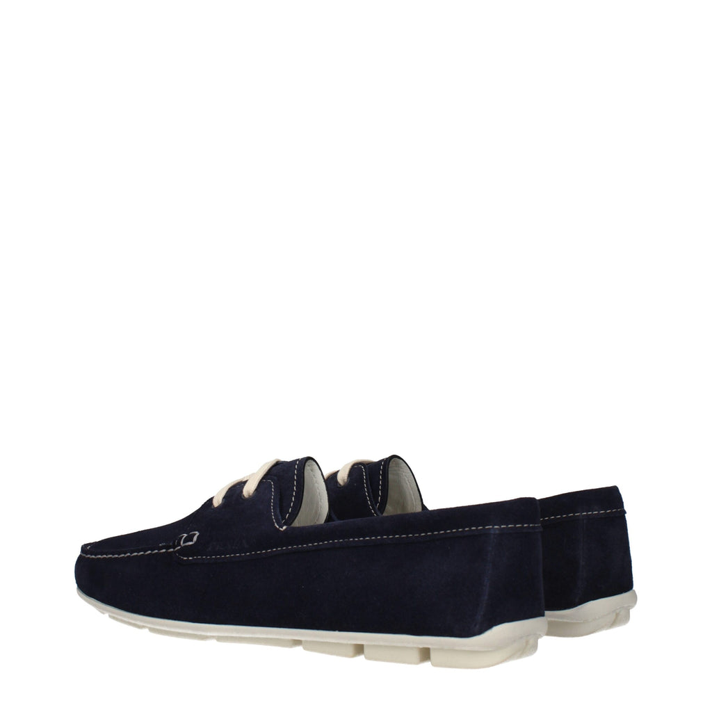 Prada blue leather slip-on loafers with sleek design and smooth finish, stylish footwear for men or women.