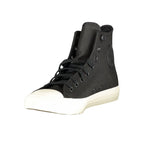 Black Converse Nero leather unisex sneaker with white rubber sole and classic low-top design.