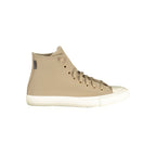 Beige leather Converse unisex sneaker with white rubber sole and classic lace-up design, suitable for casual wear.