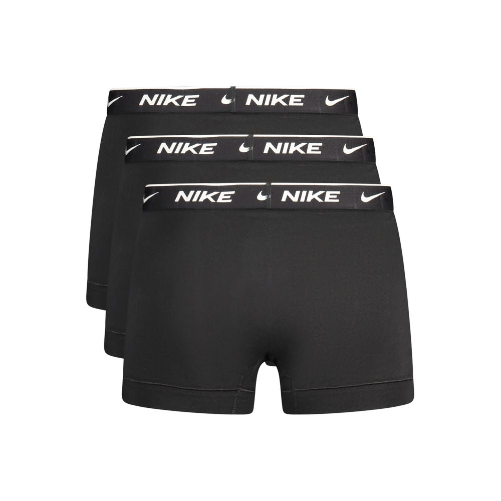 Black cotton Nike men's boxer shorts with elastic waistband and Nike logo, casual underwear for everyday wear.