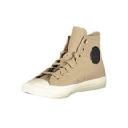 Converse beige leather unisex sneaker with white rubber sole and classic lace-up design.
