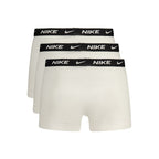White cotton men's boxer shorts by Nike with elastic waistband, displayed laid flat.