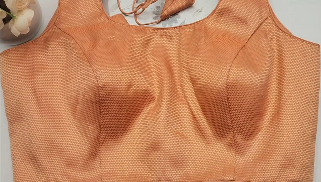 Brocade blouse with embedded floral design in Gold and light red shade sleeveless Free size Eljoys Fashion